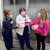 UT Southwestern employees distribute gift cards to frontline workers