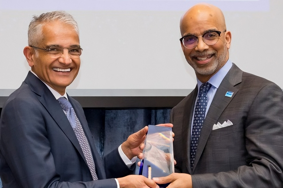 Salahuddin Kazi, M.D., left, presents the Internal Medicine Distinguished Alumni Award to Dr. Clyde Yancy.