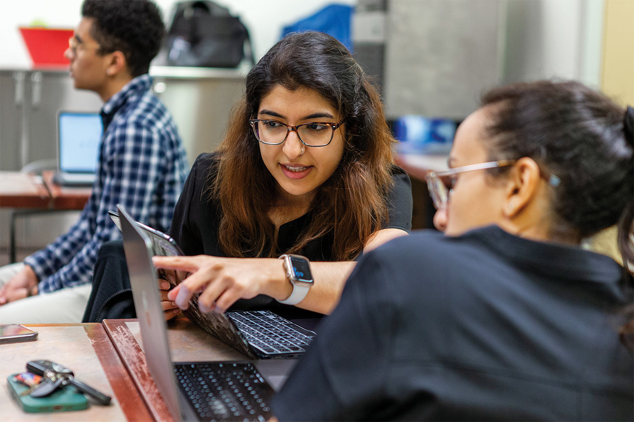 UT Southwestern students looking at laptops.