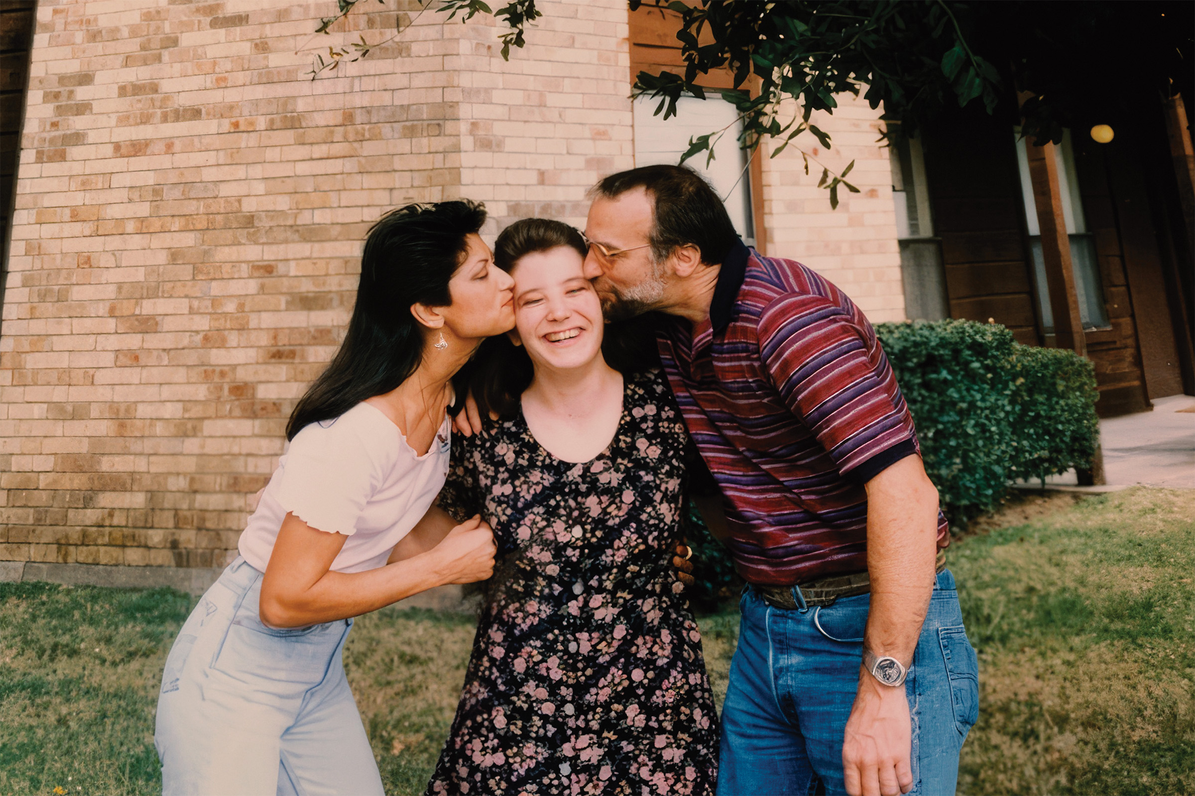 Janel Reynolds Brack middle, with John and A-Lan Reynolds.