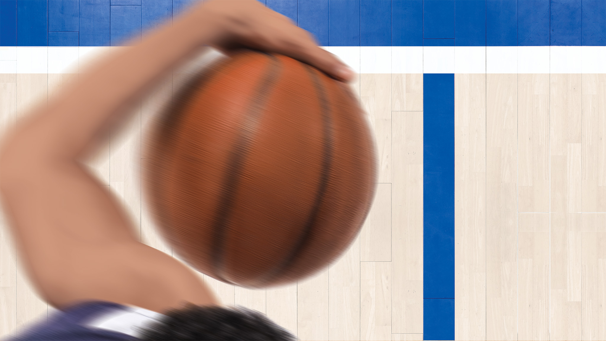 An aerial close-up view of a basketball player's arm holding a basketball.