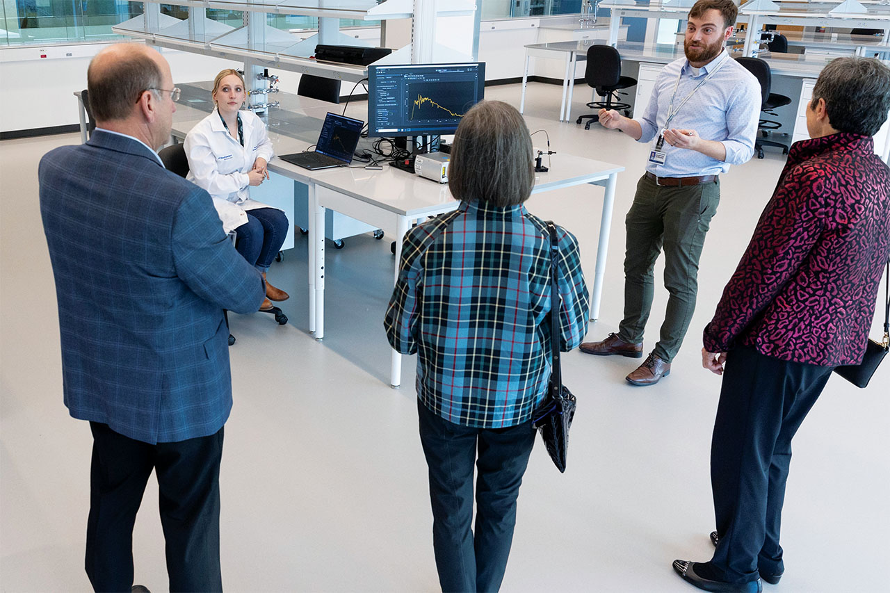 Visitors touring the building’s spaces listen as researchers from both institutions share an overview of projects already in development.